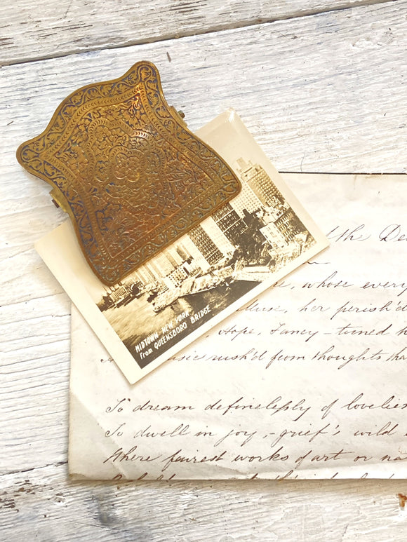 Old engraved brass paper clip