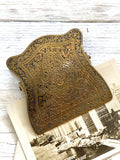 Old engraved brass paper clip