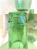 Little green glass demijohns