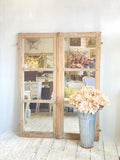 Pair of mirrored windows with original paint