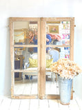 Pair of mirrored windows with original paint
