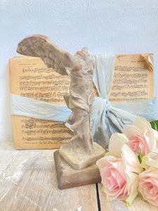 Old plaster winged goddess Victory figure