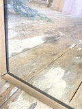 Heavily foxed antique mirror