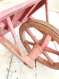 Old pink French child's wheelbarrow