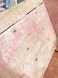 Old pink French child's wheelbarrow
