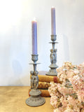 Pair of antique cherub candlesticks