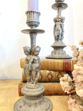 Pair of antique cherub candlesticks