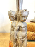 Pair of antique cherub candlesticks