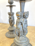 Pair of antique cherub candlesticks