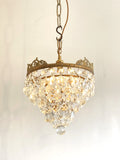 Vintage multi-tier chandelier with crested detail
