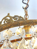 Vintage multi-tier chandelier with crested detail