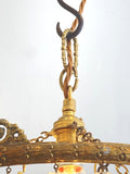 Vintage multi-tier chandelier with crested detail