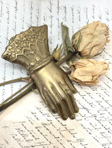 Old brass hand clip