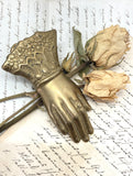 Old brass hand clip
