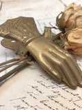 Old brass hand clip
