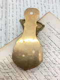 Old brass hand clip