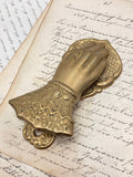 Old brass hand clip