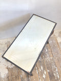 Carved side table with mirrored top