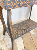Carved side table with mirrored top