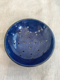 Old blue glazed strainer