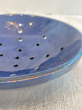 Old blue glazed strainer