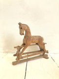 Little hand-carved toy rocking horse