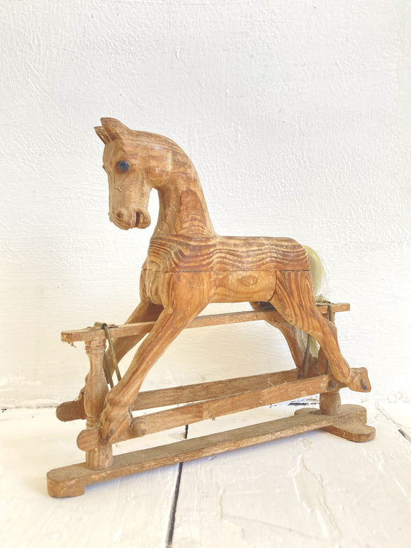 Little hand-carved toy rocking horse