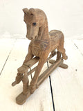Little hand-carved toy rocking horse