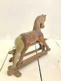 Little hand-carved toy rocking horse